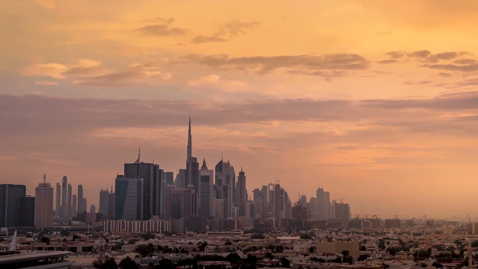 Illustrative view of an urban skyline at sunset