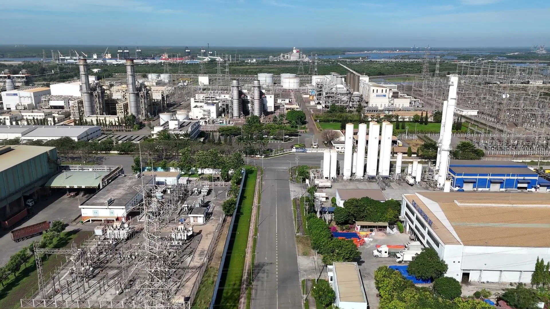 Aerial view of an industrial campus with production buildings, access roads and operating infrastructure