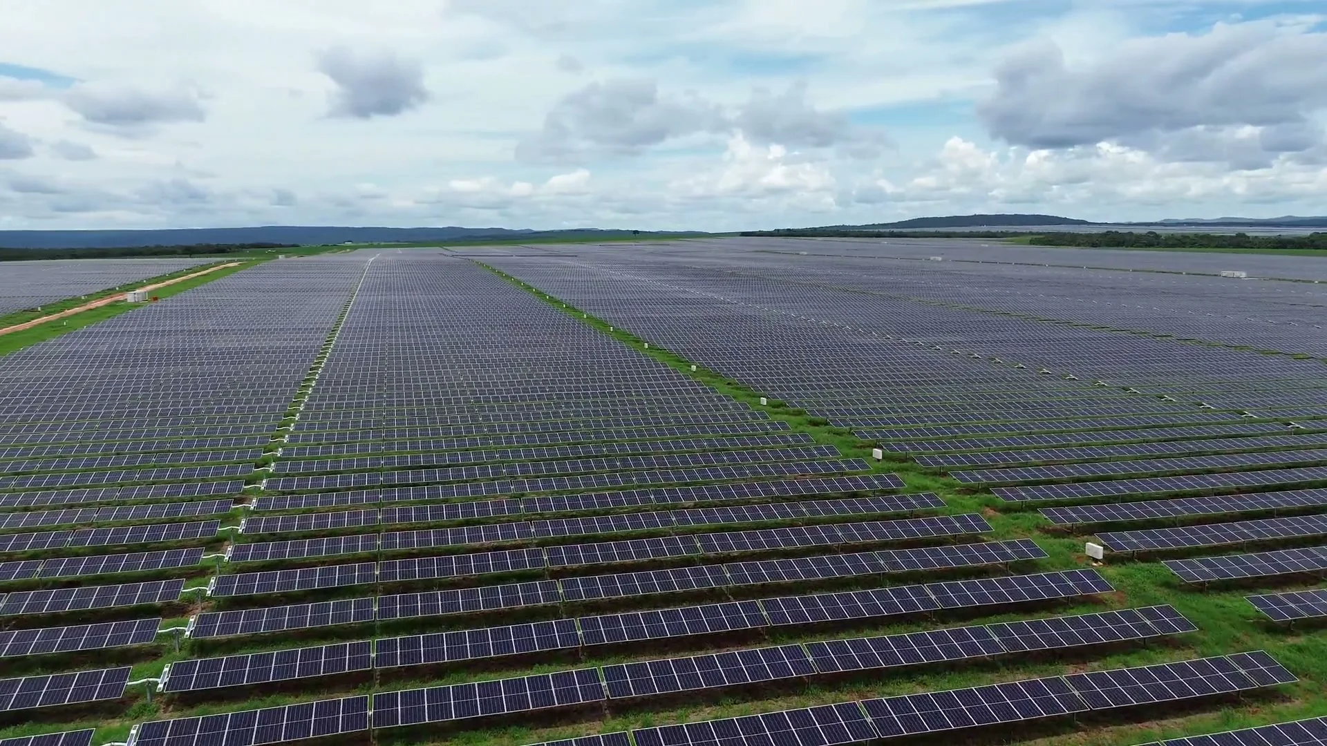Aerial view of solar arrays across an extensive energy landscape